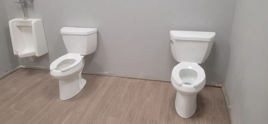 Commercial restroom toilet and urinal fixtures