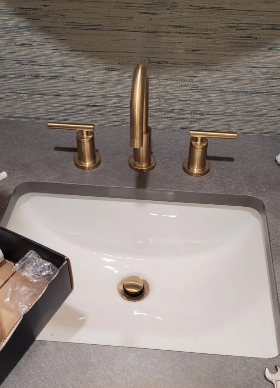 New brushed-brass bathroom faucet installed by Drip Happens
